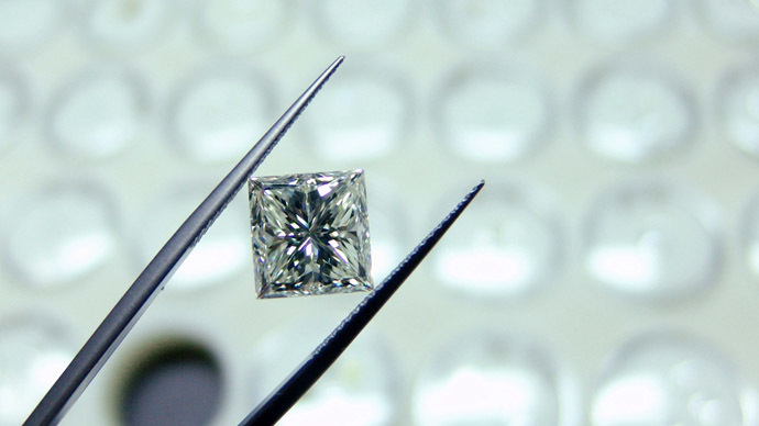 Gem-cutting and jewel-making at the Kristall Works in Smolensk. Demonstrating a newly cut diamond. (RIA Novosti/Ekaterina Chesnokova)